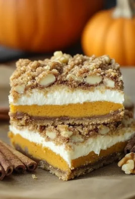 Pumpkin Cheesecake Bars with Walnut Crust and Streusel Topping